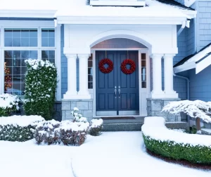 Ways To Enhance Your Front Entrance: Plant Foliage And Shrubbery; Shrubbery in the front entrance of a home in the winter