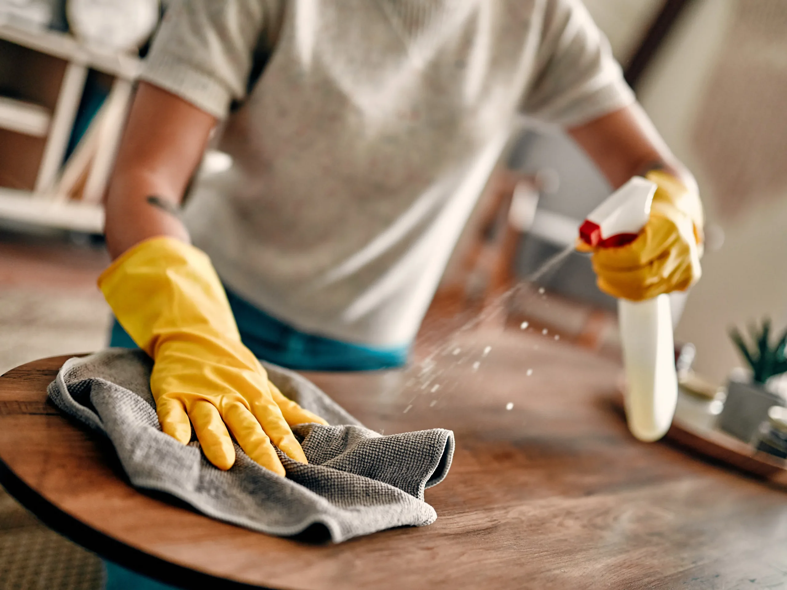 person deep cleaning home as part of the spring cleaning checklist