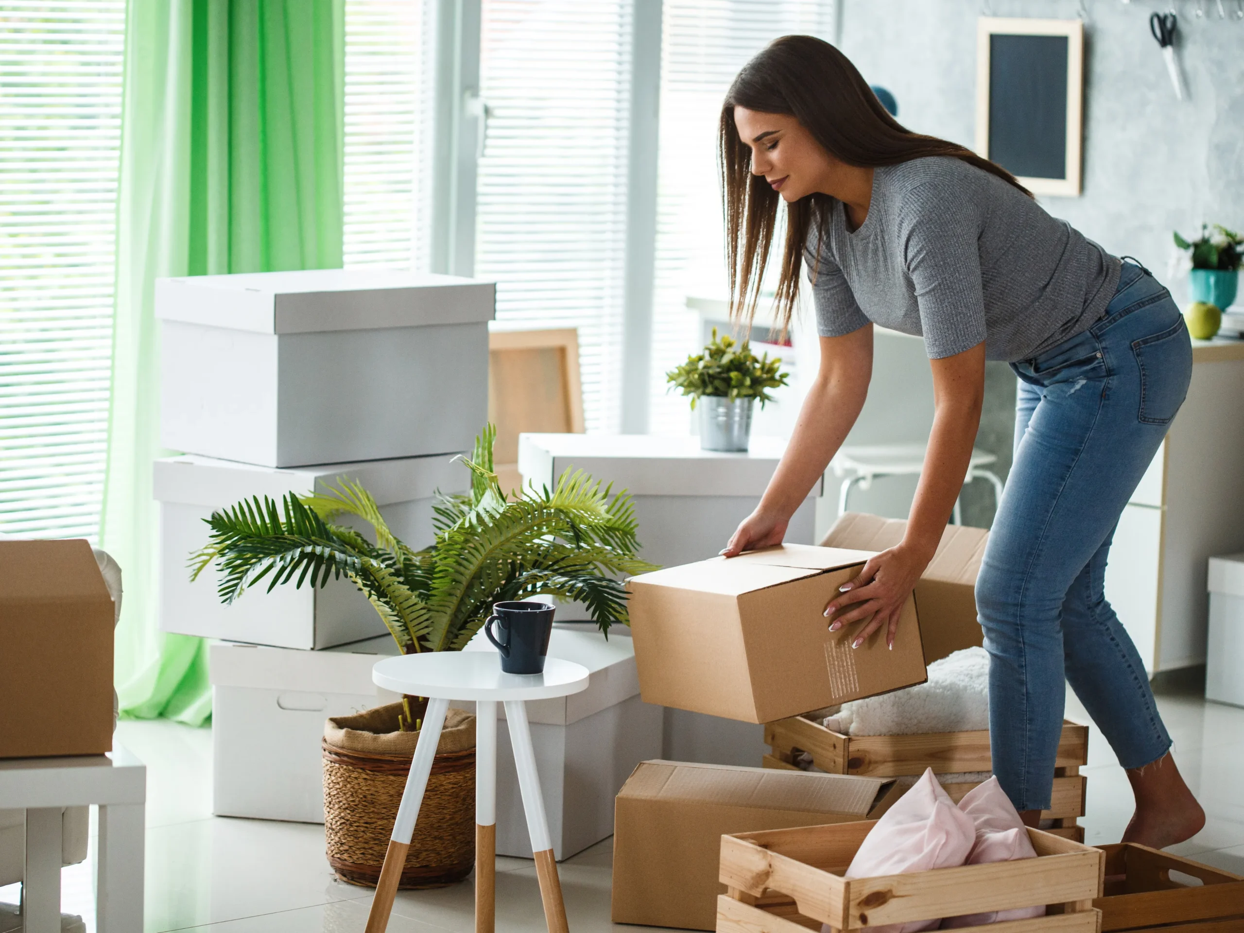 woman organizing things in living room