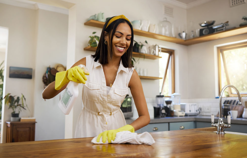 Woman does a spring clean in the kitchen