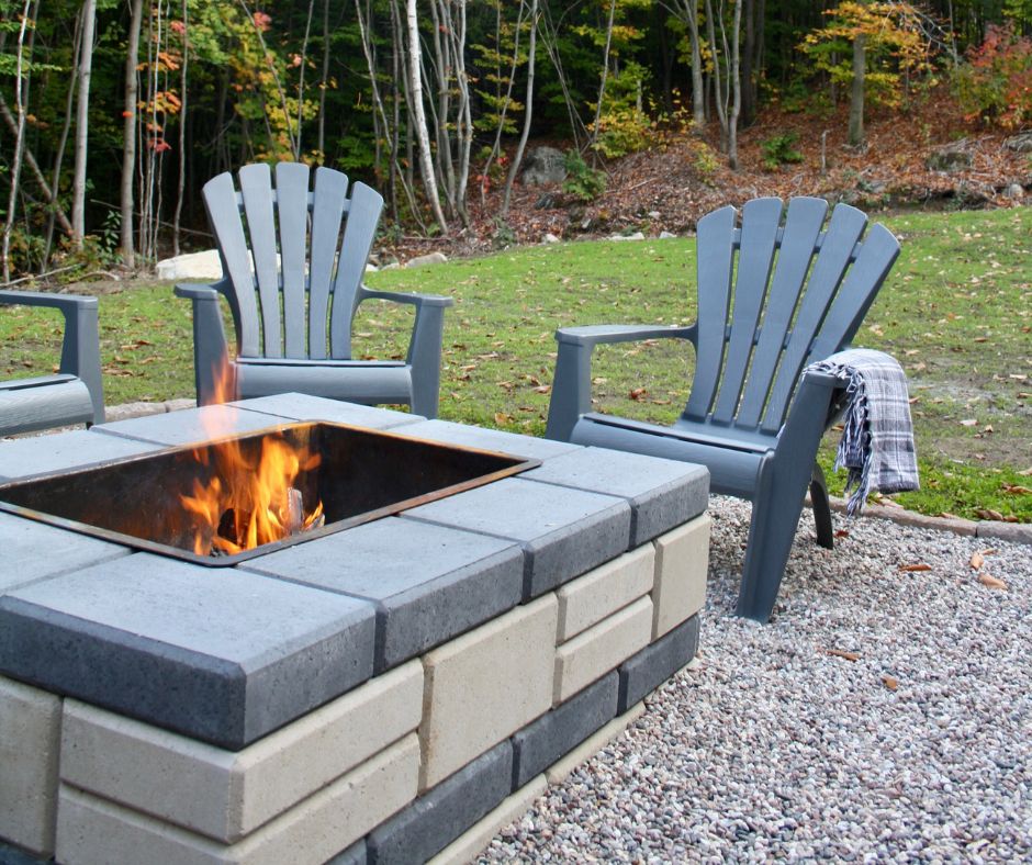 Chairs gathered around a fire pit in backyard