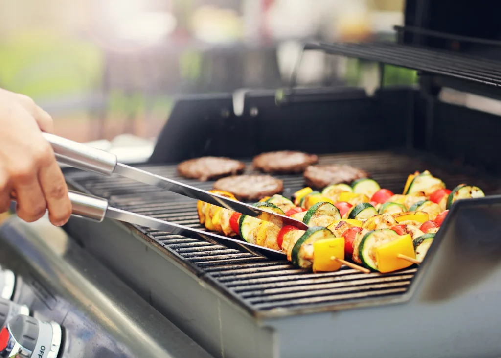 Grilling kabobs on a grill