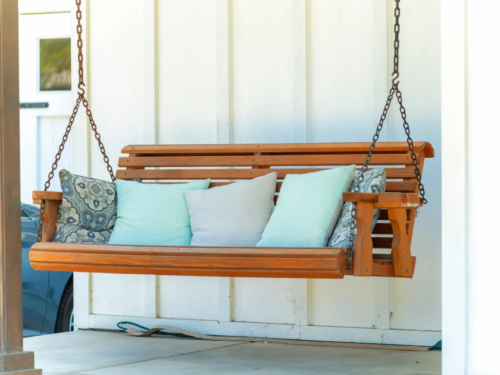 swinging bench with outdoor cushions