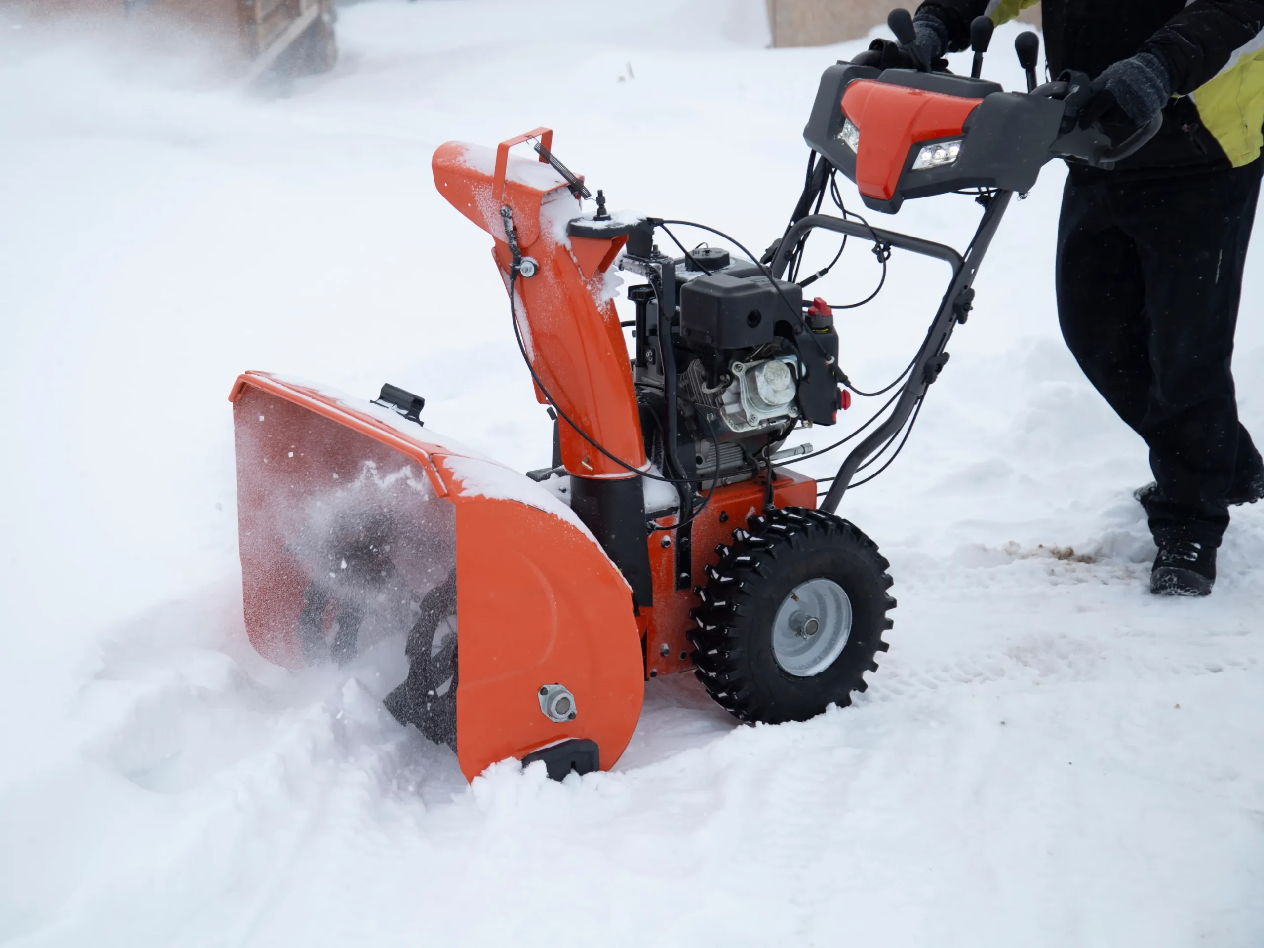 snow blower plowing snow