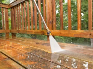 pressure washing a dirty deck